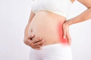 Hva er årsakene til magesmerter under graviditeten